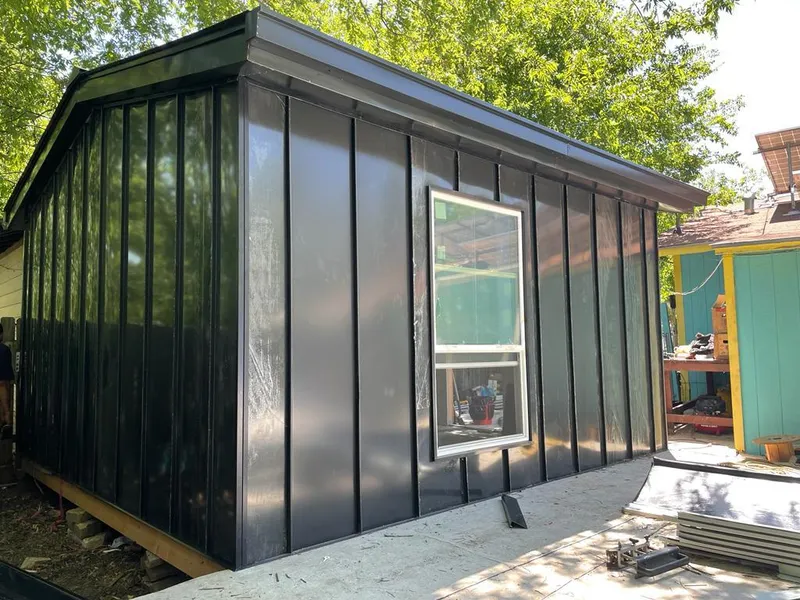 Black standing seam metal wall panels for Roof Inspection in Reminderville