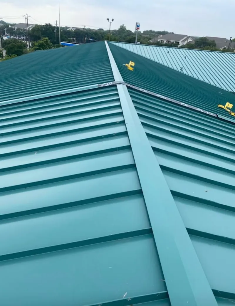 Green commercial metal roof ridge and valley for Metal Roof Repair in Reminderville