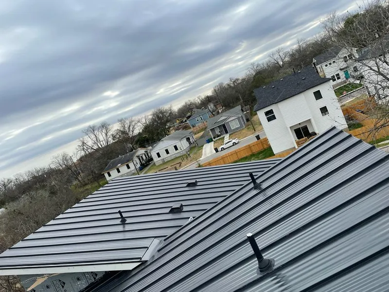 Standing seam metal roof panels with vents for Skylight Repair in Reminderville
